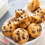 A tempting visual of CHOCOLATE CHIPS MUFFINS, showcasing golden-brown muffins with a moist crumb and generous chocolate chips.