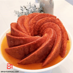 Indulge in the visual feast of a freshly baked Golden Rum Cake, adorned with a golden caramel glaze. The moist texture and rich aroma promise a delectable culinary experience, inviting you to savor the exquisite flavors of this golden delight. A masterpiece of baking perfection awaits, capturing the essence of pure indulgence in every slice.