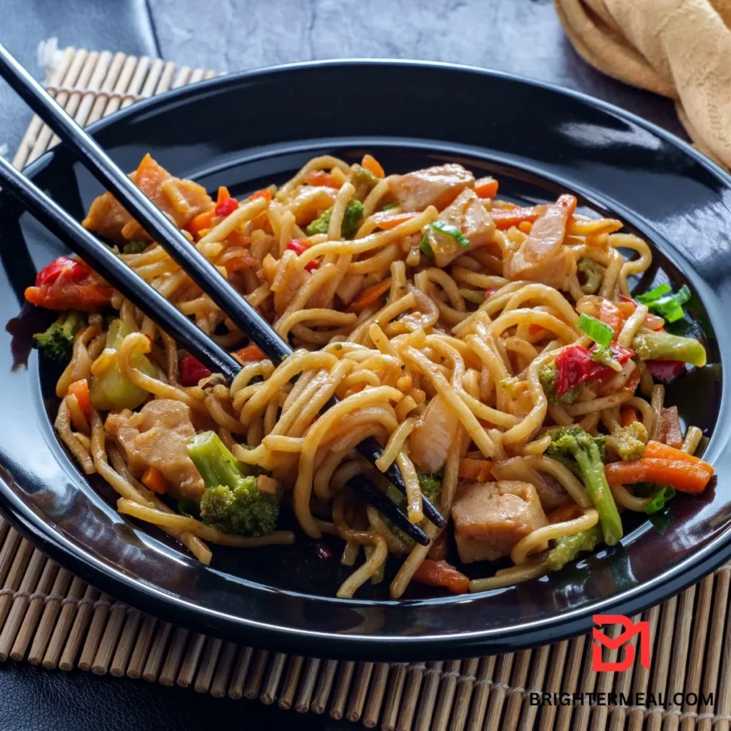 Plate of Chicken Chow Mein with vegetables and noodles