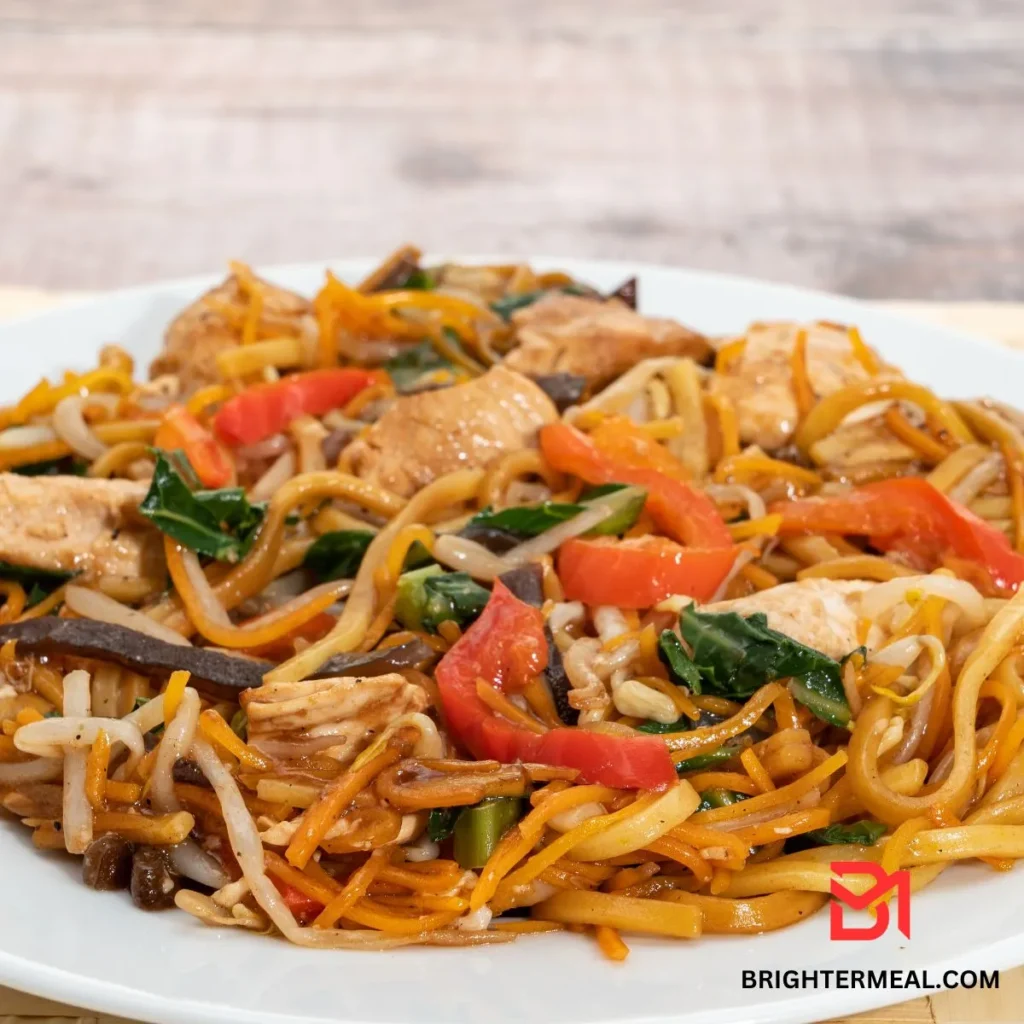 Ingredients for Chicken Chow Mein laid out on a kitchen counter