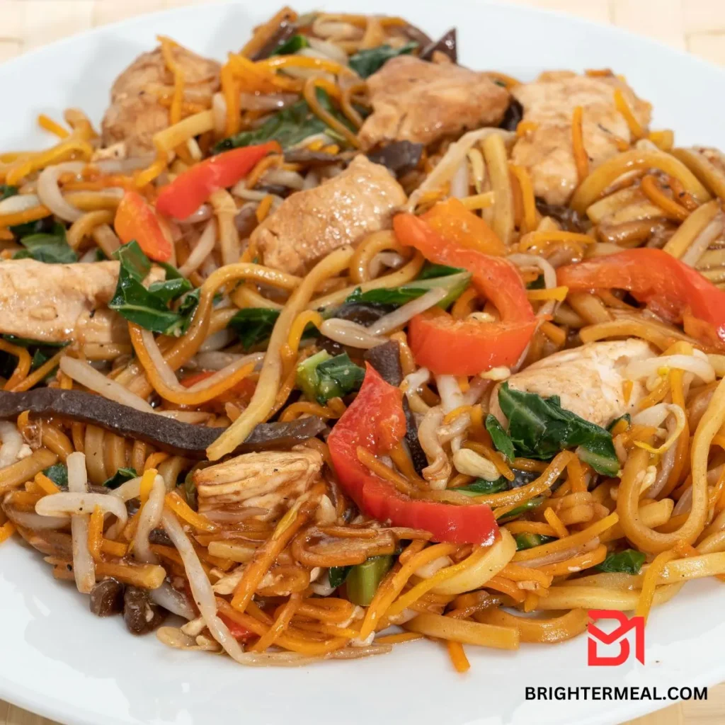 Stir-frying chicken in a hot wok