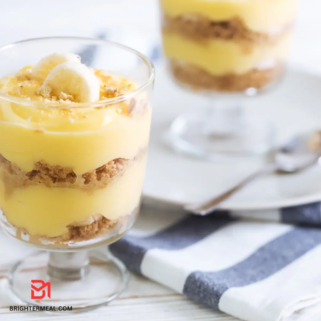 Layered banana pudding dessert in a glass dish