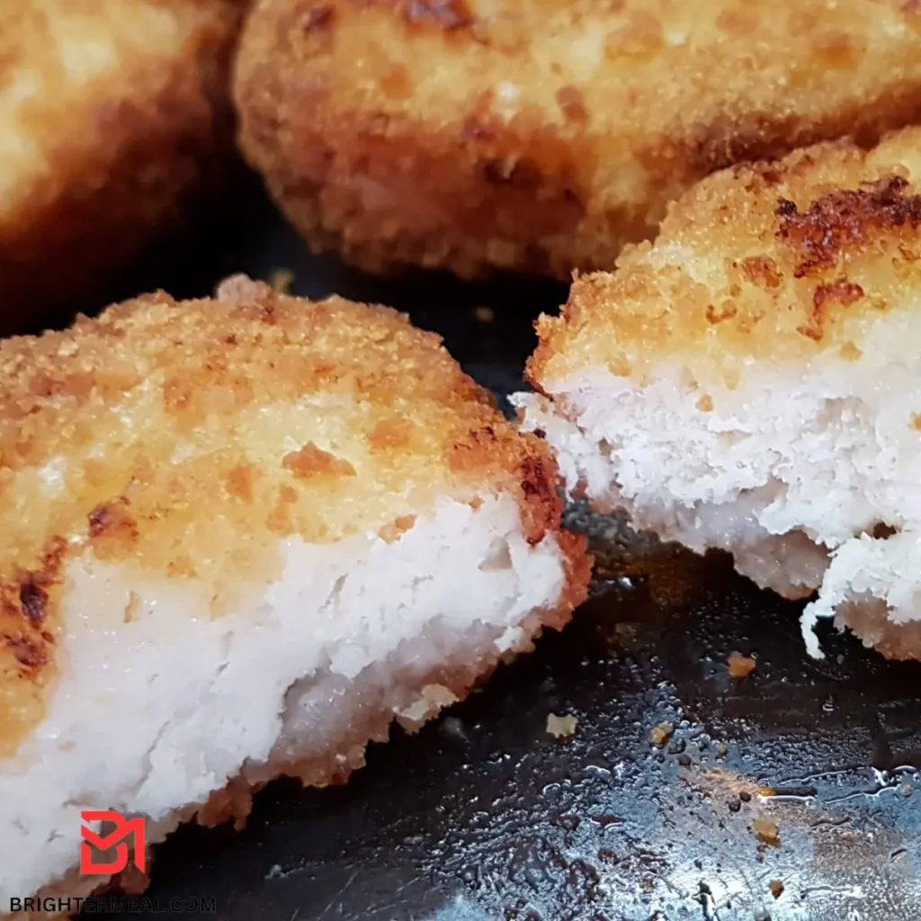 Air fryer chicken strips ready to enjoy with a side of dipping sauce.