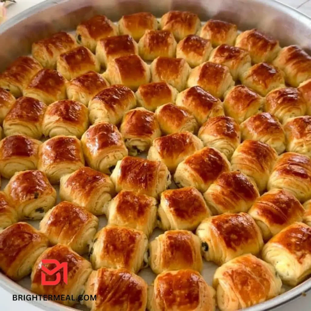 Golden Lokma dumplings dripping with sweet syrup.