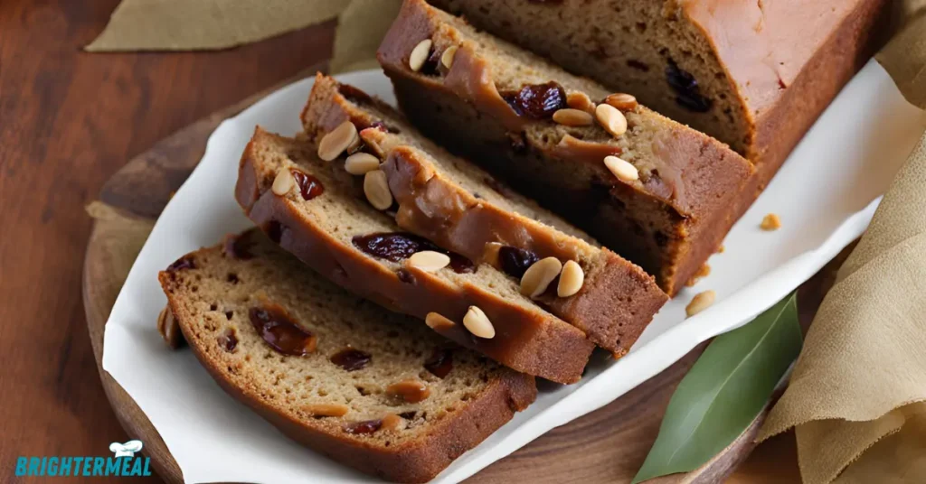 Pouring date nut bread batter into a greased loaf pan.