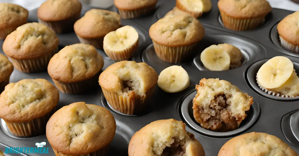 Freshly baked mini banana muffins cooling on a wire rack