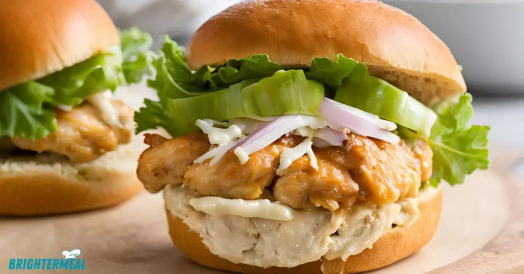 Chicken sliders on toasted buns with melted cheese
