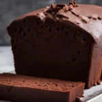 Image of rich chocolate pound cake sliced and ready to serve.