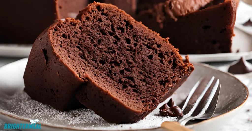 Freshly baked chocolate pound cake cooling on a rack.