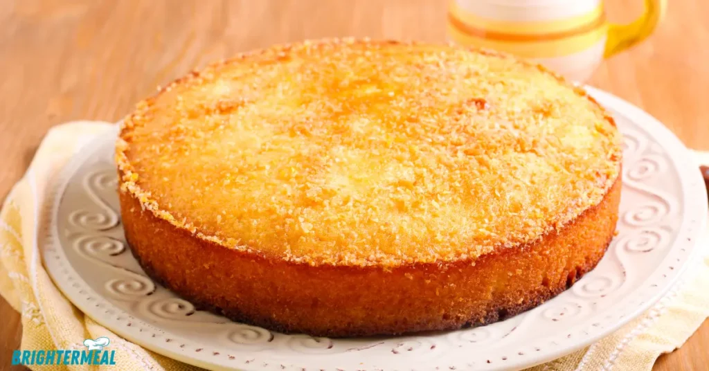 Syrup cake slice served with a scoop of vanilla ice cream