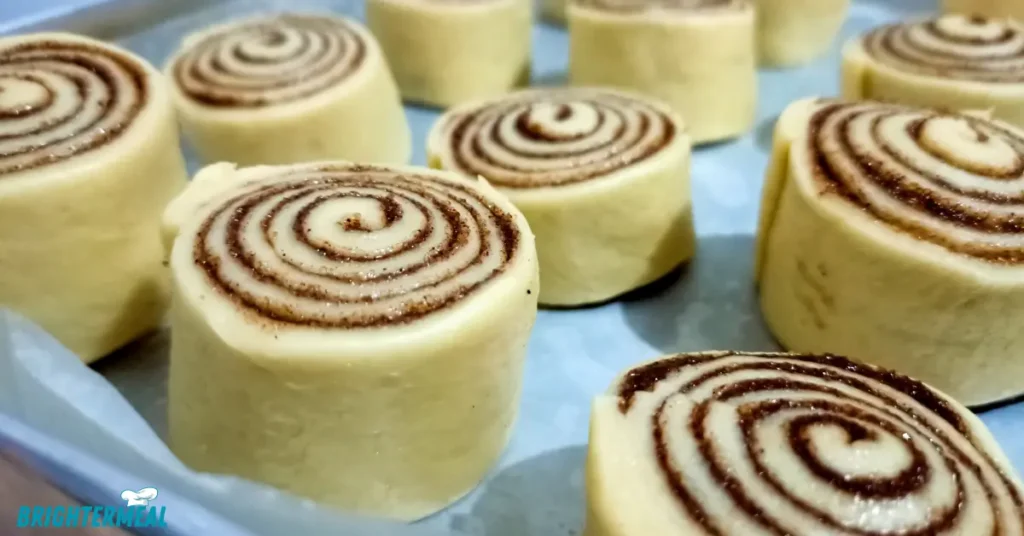 Close-up of a single banana bread cinnamon roll with icing