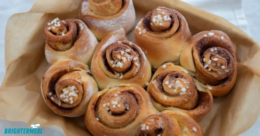 Banana bread cinnamon roll with a bite taken, showing soft texture