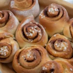 Banana bread cinnamon roll with a bite taken, showing soft texture
