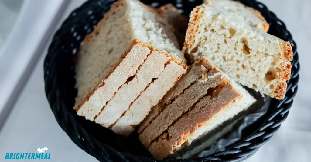Baked sourdough sandwich bread on cooling rack