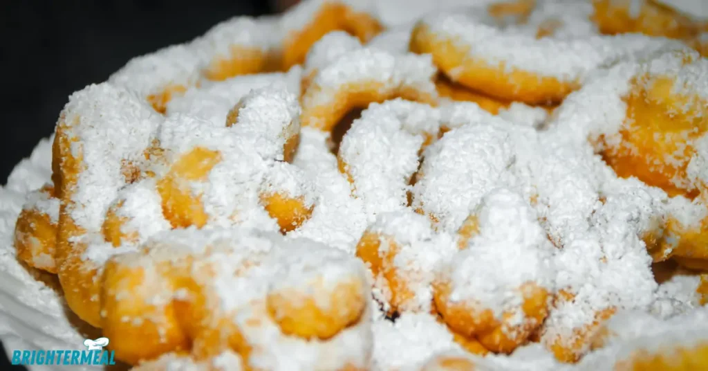 Funnel cake batter being poured into hot oil