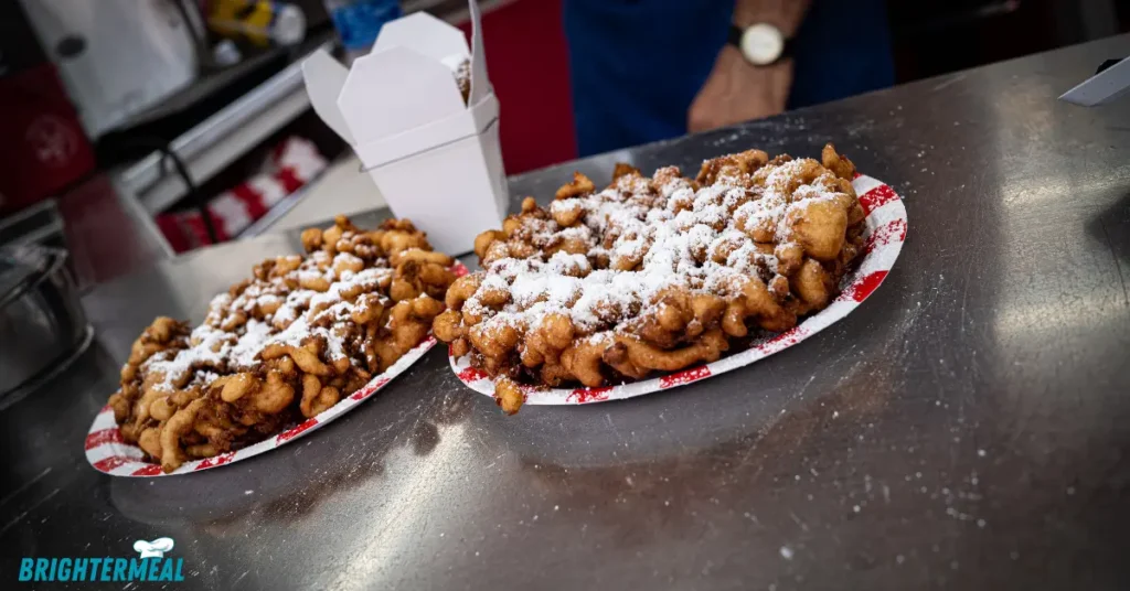Funnel cake with a scoop of vanilla ice cream