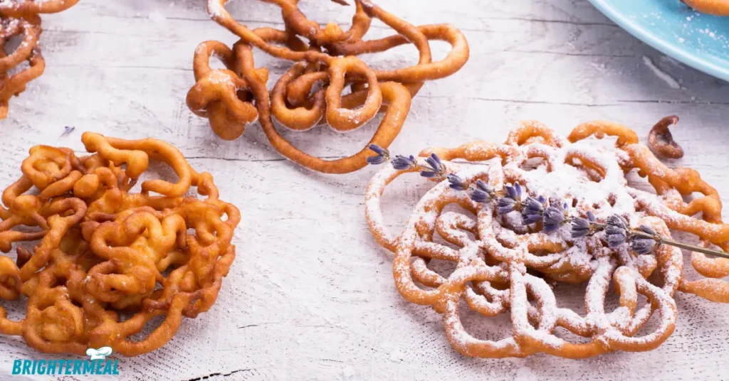 Golden brown funnel cake topped with powdered sugar