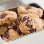 Mixing bowl with cookie dough and chocolate chips.