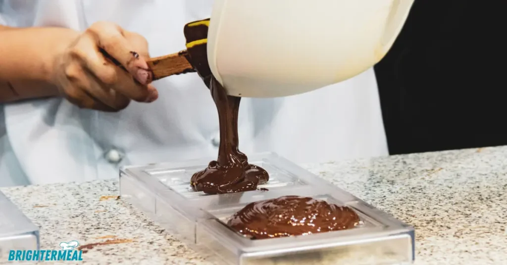 Chocolate chips melting in a microwave-safe bowl.