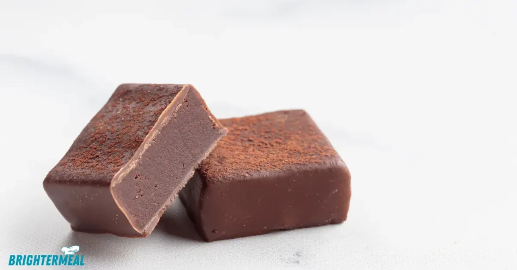 Smooth fudge in an 8x8 baking dish ready to set.