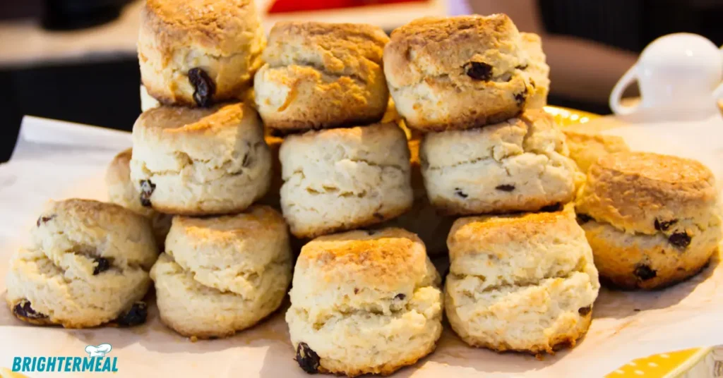 Freshly baked sourdough scones on a wire rack.