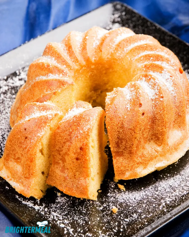 Bundt pan filled with slice batter, ready for baking.