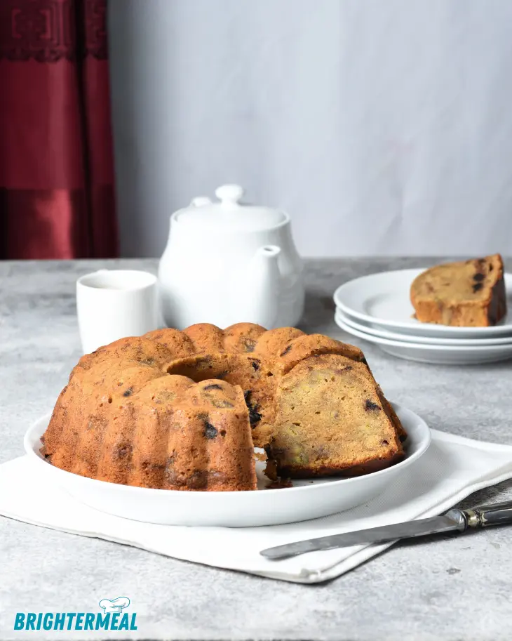 Top view of a golden banana Bundt cake cooling on a wire rack