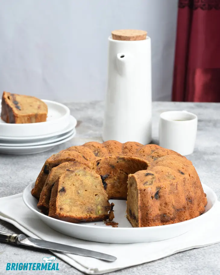 Slice of moist cake on a dessert plate with a fork
