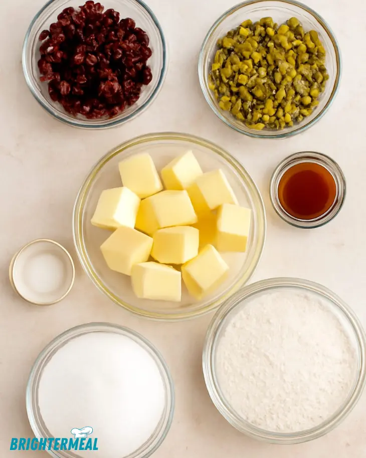 Close-up of crumbly shortbread cookies with festive ingredients.