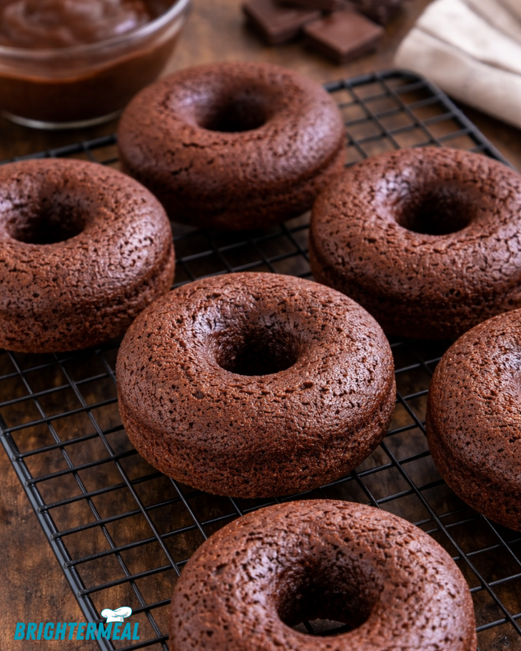 homemade donuts stacked on a plate